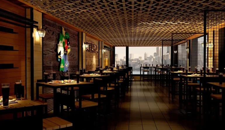 Modern restaurant interior with stylish seating, industrial design elements, and a view of the city skyline through large windows.