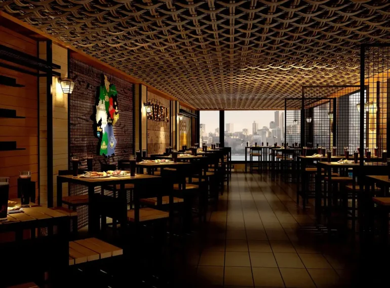 Modern restaurant interior with stylish seating, industrial design elements, and a view of the city skyline through large windows.